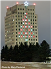 Lights in the North Dakota State Capitol Building lit up to resemble a Christmas tree. 