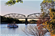 Riverboat traveling under the Railroad Bridge on the Missouri River. 