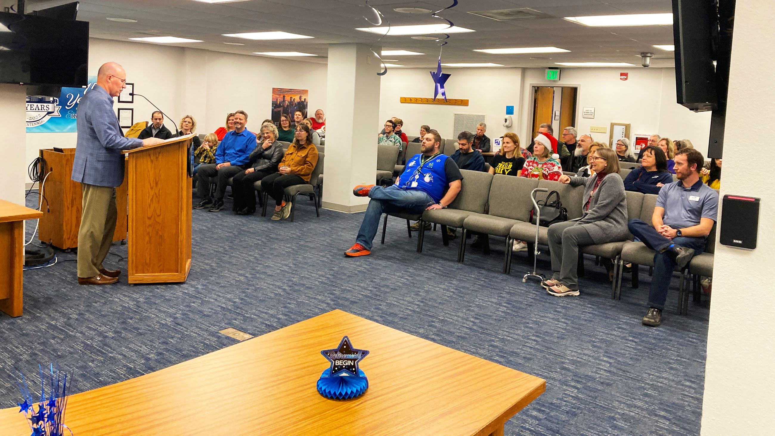 Mayor Mike Schmitz talks to staff during the retirement event for City Administrator Keith Hunke. 