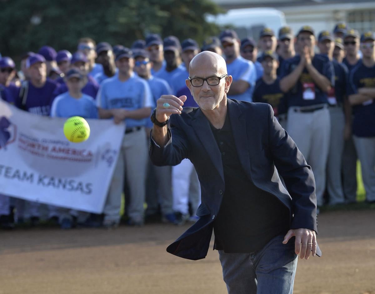 Mayor Mike Seminary delivers the first pitch at a softball tournament in Bismarck. 