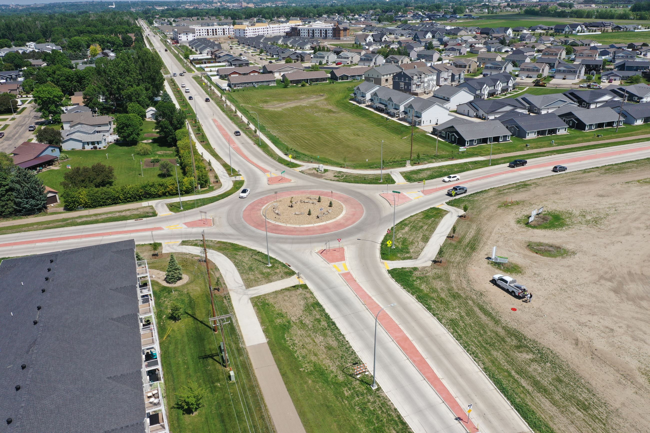 Traffic enters and exits a roundabout. 