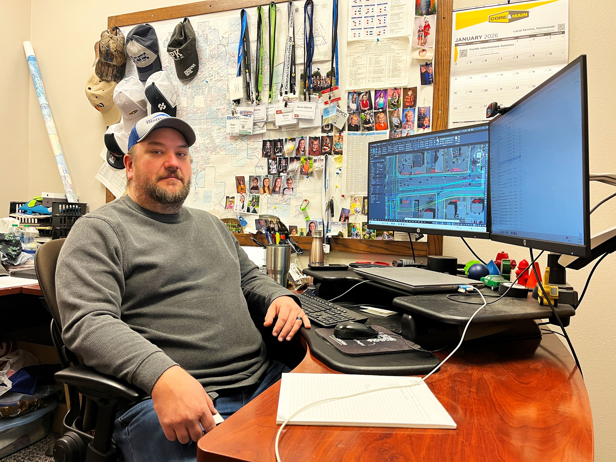 A man sitting at a desk in an office.