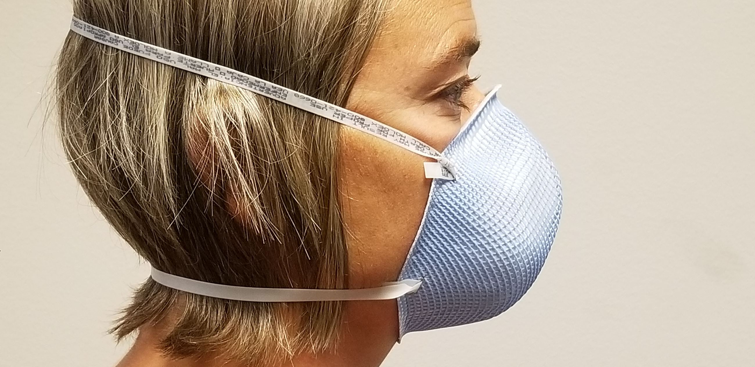 Woman wearing N95 mask JPEG