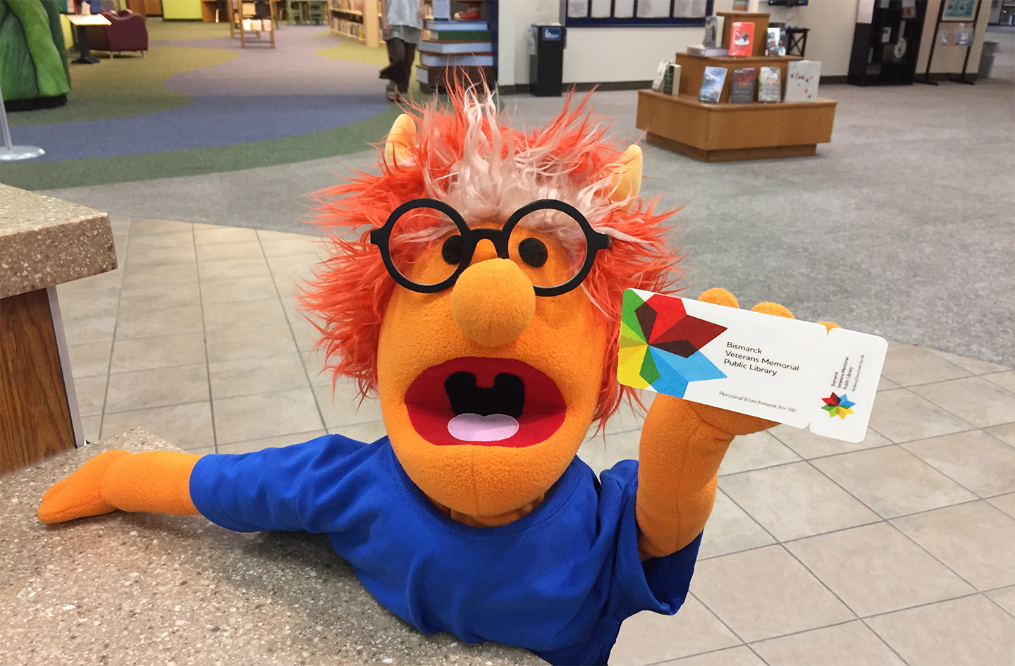 Puppet Holding Library Card