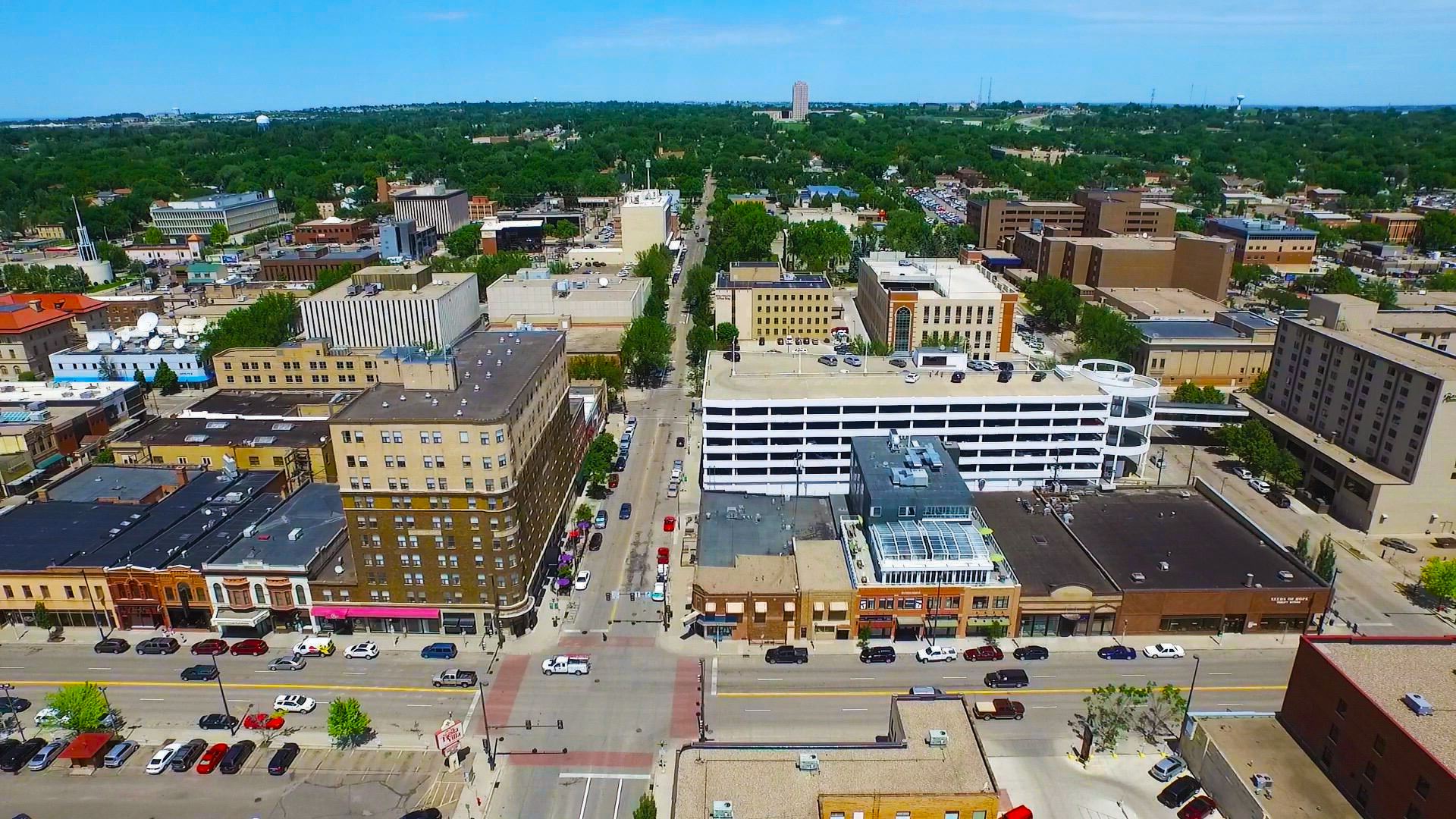 This aerial shot of downtown Bismarck's Main Street faces north with the State Capitol in backgro