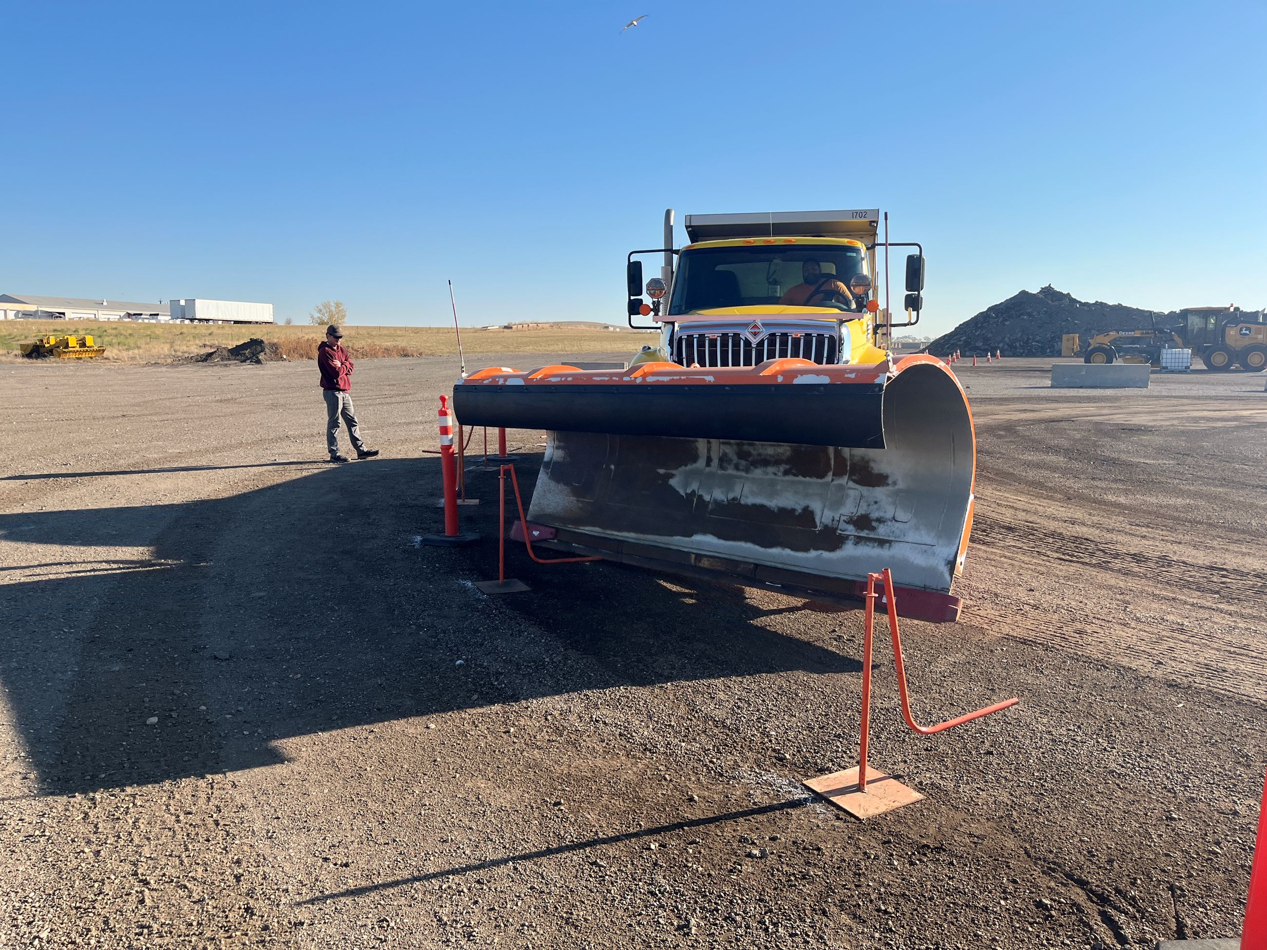 A heavy equipment operator competes in a plow truck competition at the 2024 Public Works Roadeo. 