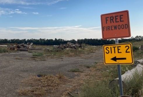 Firewood image at LF with direction sign